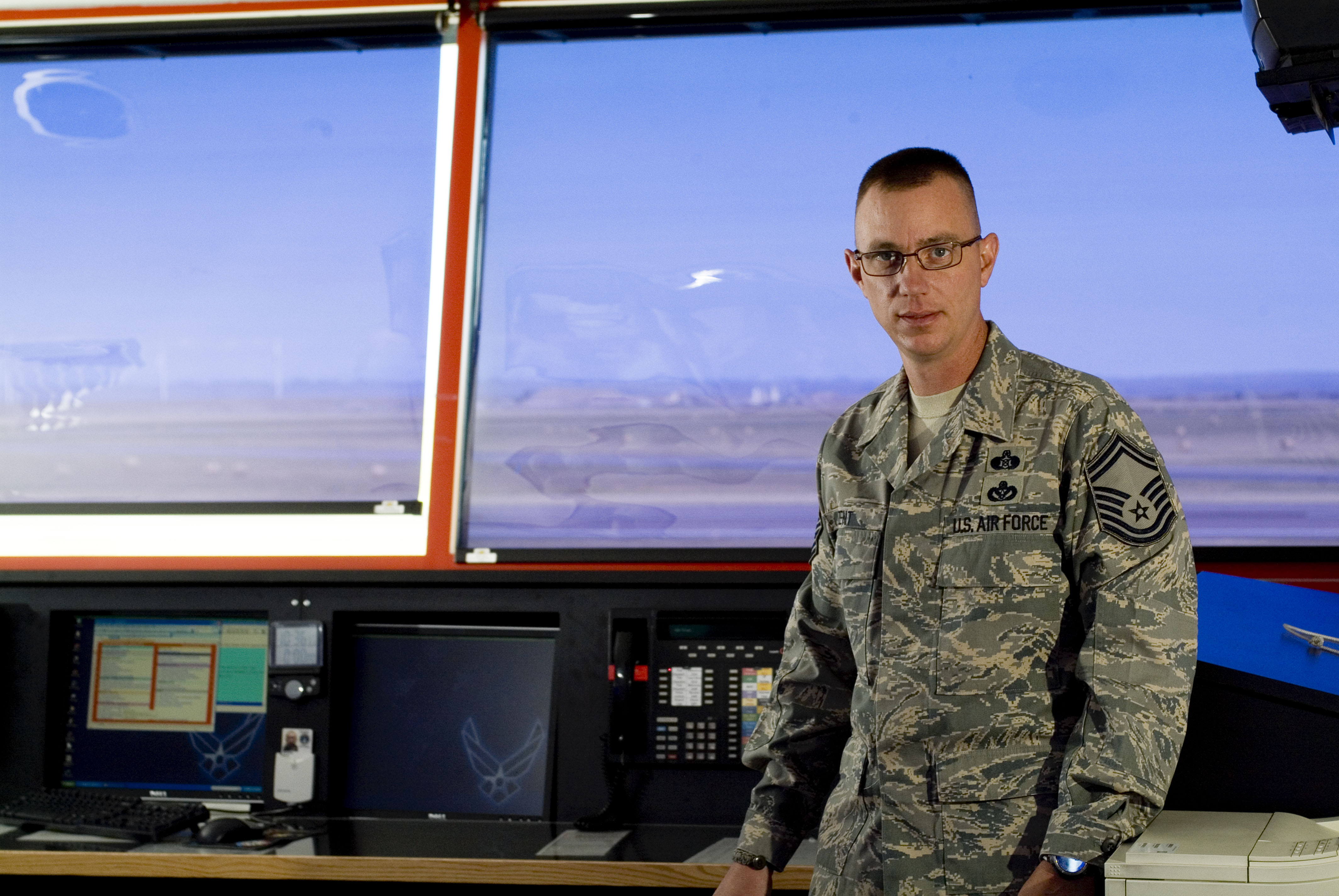 Dan Zent (from Great Falls, MT) is pictured in an Air Force control tower and takes online classes at American Military University.