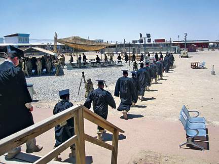 UMUC students participate in a
combined graduation ceremony in
Kandahar, Afghanistan last May.