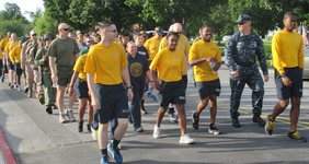 Service members and civilian personnel at Naval Support Activity Annapolis participate in a six-mile road march in honor of the 70th Anniversary of D-Day, June 6. More than 160,000 allied troops, supported by 5,000 ships and 13,000 aircraft, invaded Europe along the Normandy coastline in western France in 1944, marking the turning point of the European Theater of World War II.